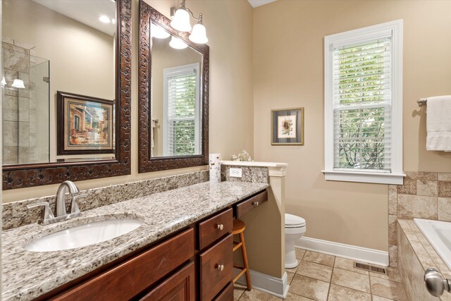 1119 Bruton Blvd, Moncks Corner, SC 29461 - bathroom featuring plenty of natural light, baseboards, vanity, and a garden tub