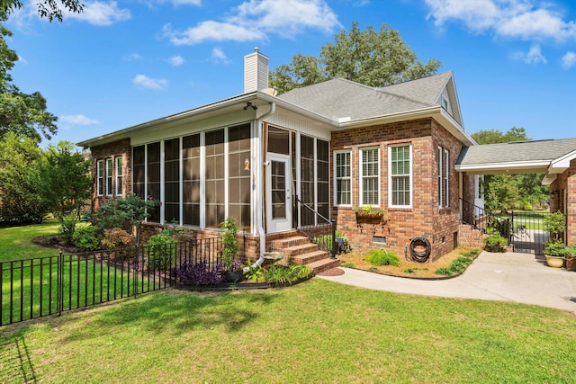 1119 Bruton Blvd, Moncks Corner, SC 29461 - rear view of house with brick siding, a sunroom, a chimney, crawl space, and roof with shingles