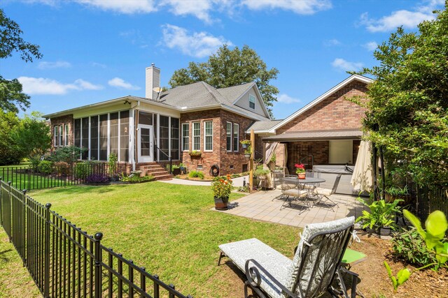 1119 Bruton Blvd, Moncks Corner, SC 29461 - rear view of property with brick siding, a sunroom, a chimney, and a patio area