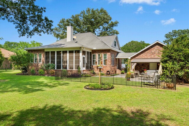 1119 Bruton Blvd, Moncks Corner, SC 29461 - rear view of house with brick siding, a patio, a sunroom, and a chimney