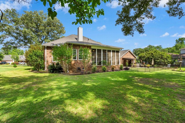 1119 Bruton Blvd, Moncks Corner, SC 29461 - rear view of property with a sunroom, brick siding, and a chimney