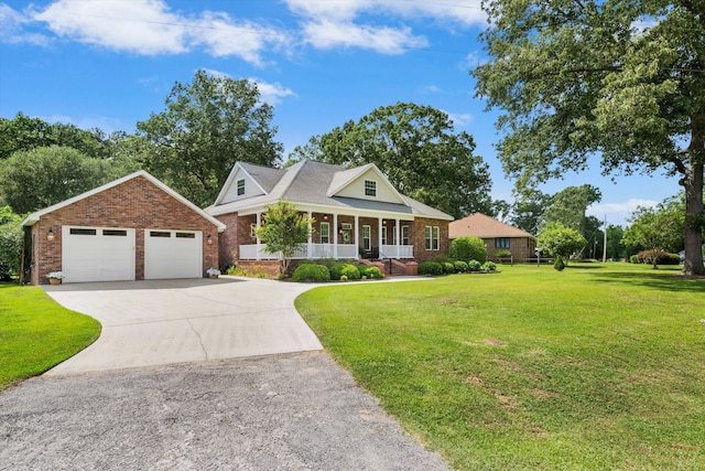 1119 Bruton Blvd, Moncks Corner, SC 29461 - view of front of house featuring a porch, brick siding, a detached garage, and a front yard