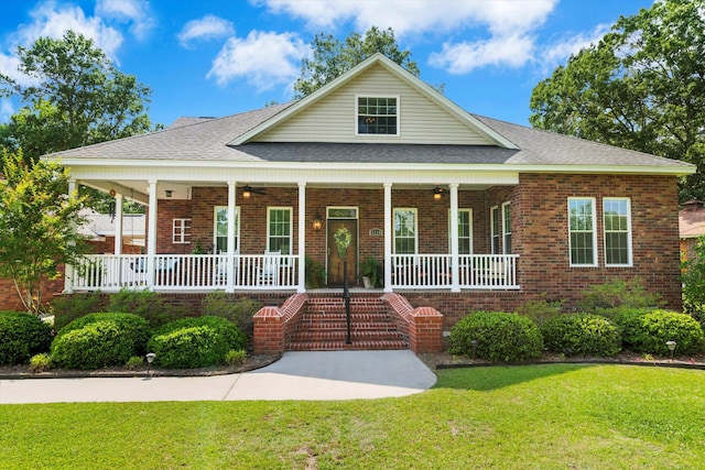 1119 Bruton Blvd, Moncks Corner, SC 29461 - view of front facade featuring a porch, brick siding, a front lawn, and ceiling fan