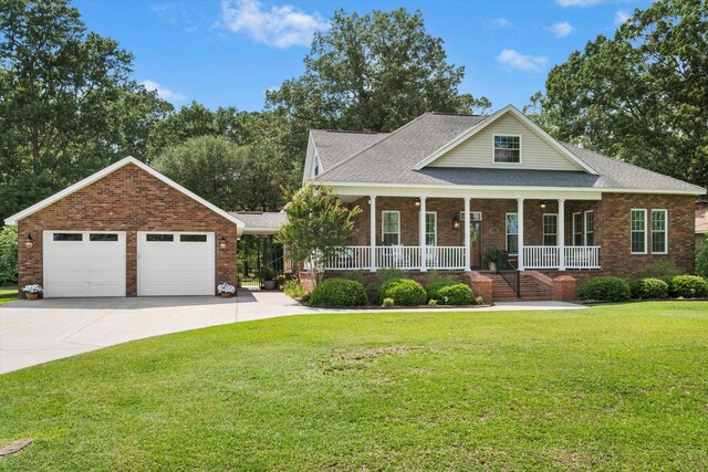 1119 Bruton Blvd, Moncks Corner, SC 29461 - view of front of property with a garage, covered porch, a front yard, brick siding, and roof with shingles