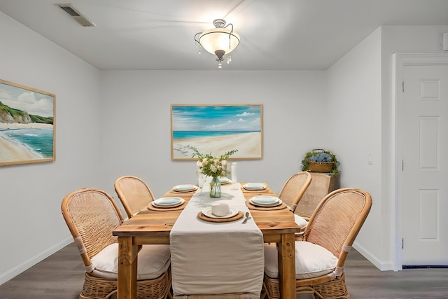 dining room with wood finished floors and baseboards