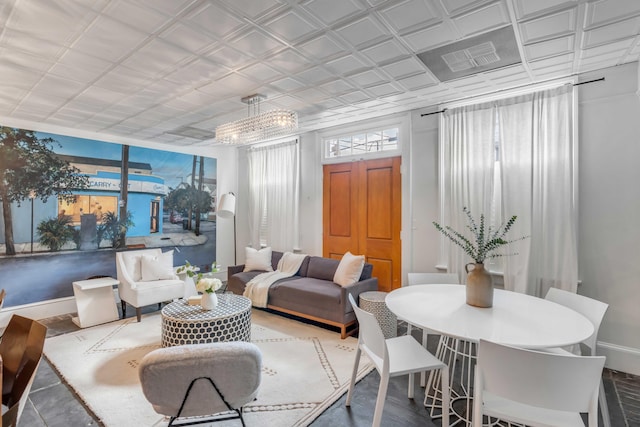 sunroom featuring a chandelier