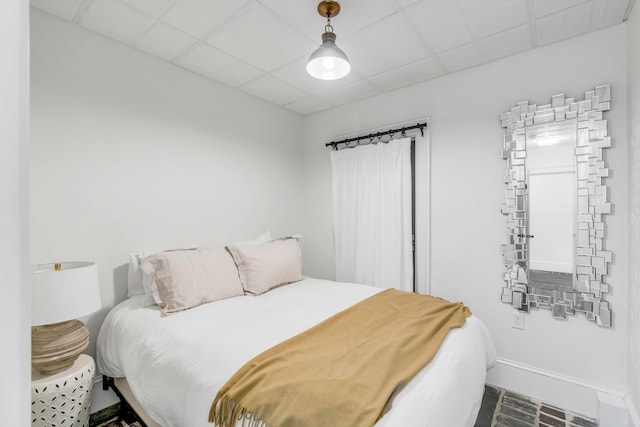 bedroom featuring a drop ceiling