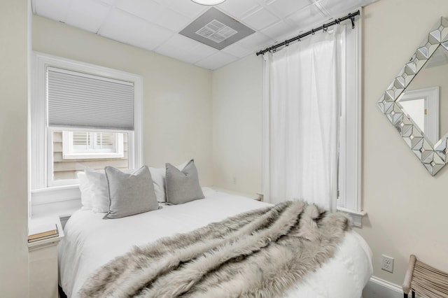 bedroom featuring a paneled ceiling