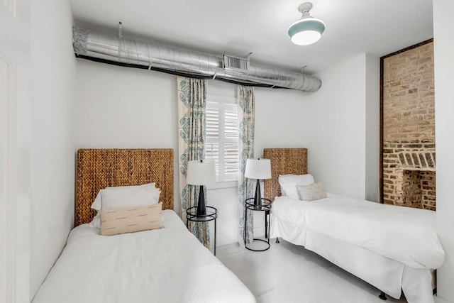 bedroom featuring concrete flooring