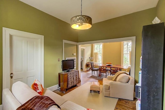 living room featuring baseboards and wood finished floors