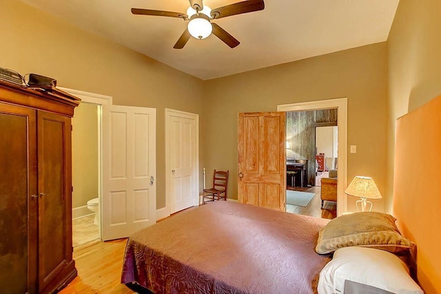 bedroom with light wood-type flooring and ceiling fan