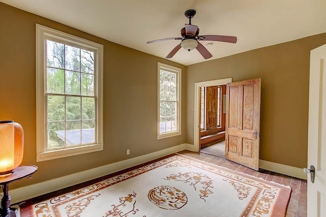 bedroom with baseboards and ceiling fan