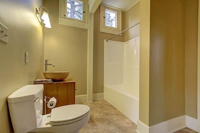 full bath with vanity, baseboards, shower / bath combination, tile patterned floors, and toilet