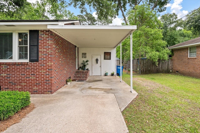 2220 Pinehurst Ave, Charleston, SC 29414 - entrance to property with driveway, brick siding, and a carport