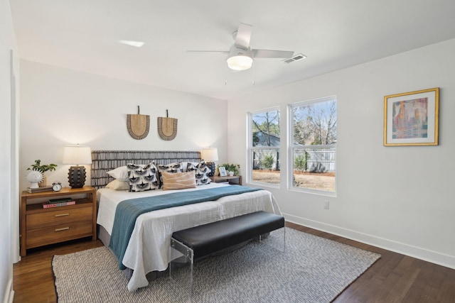 bedroom featuring dark hardwood / wood-style flooring and ceiling fan