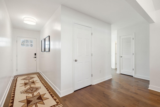 corridor with dark hardwood / wood-style floors