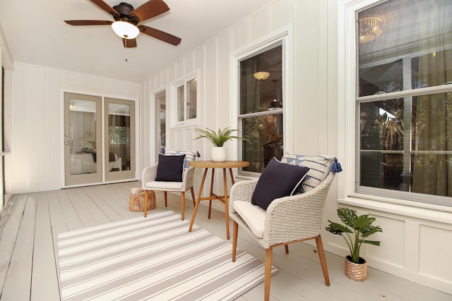 sunroom with a ceiling fan