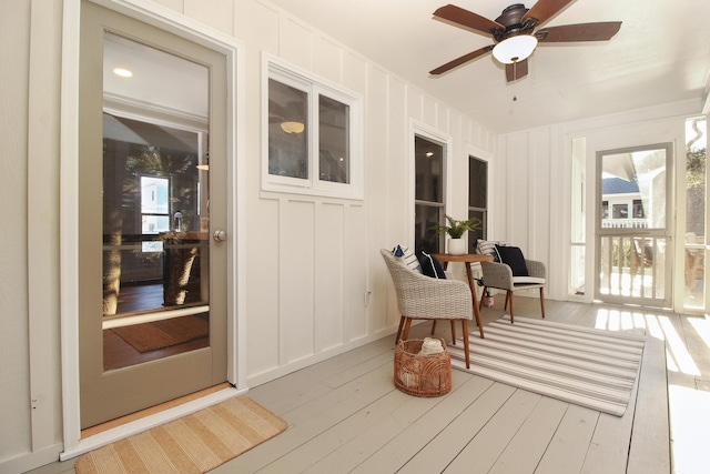 sunroom / solarium with ceiling fan