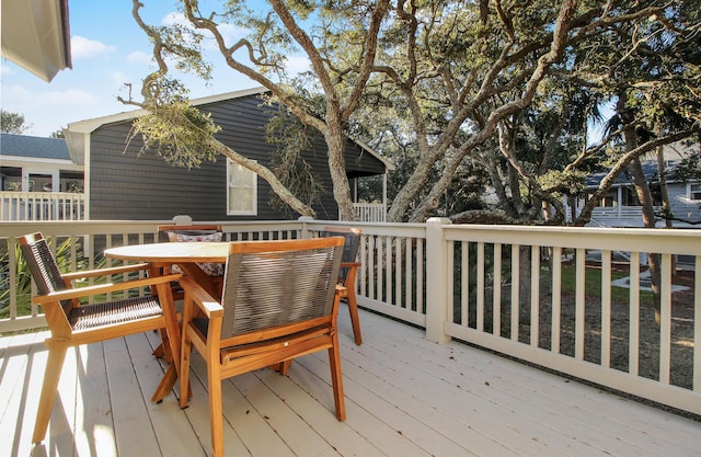 deck featuring outdoor dining area