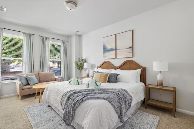 bedroom with carpet flooring and baseboards
