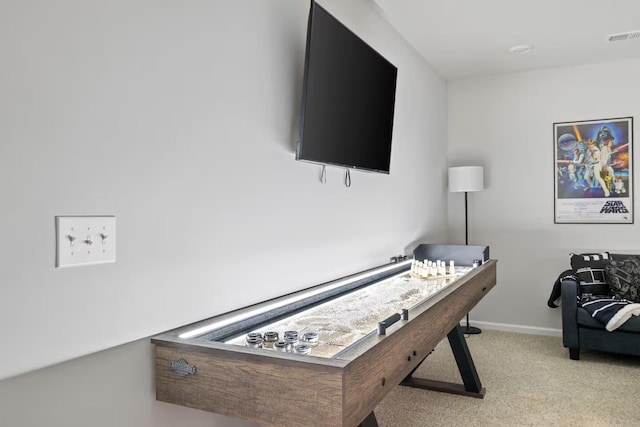 carpeted living area with baseboards