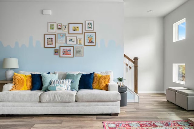 living room featuring wood finished floors and baseboards