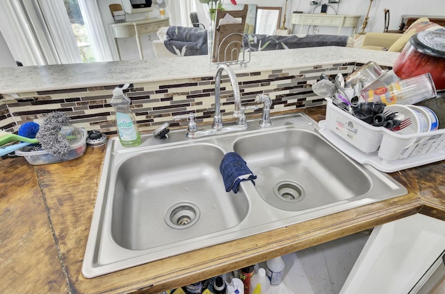 details with a sink and backsplash