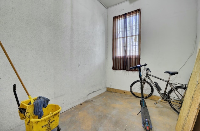 interior space with unfinished concrete flooring