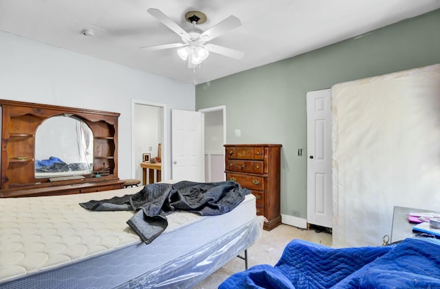 bedroom with baseboards and a ceiling fan