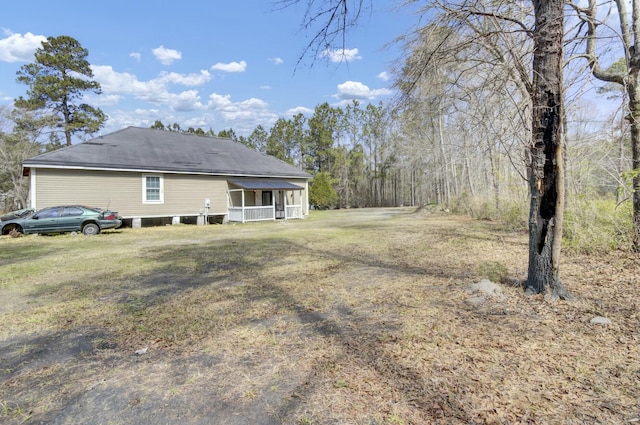 back of house with a lawn