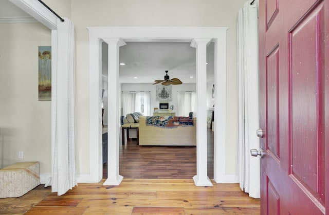 entrance foyer with ornate columns, recessed lighting, a ceiling fan, and light wood-style floors