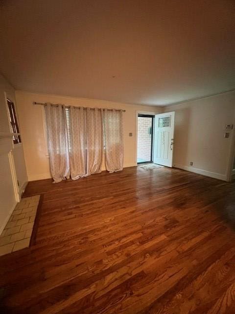 spare room featuring dark hardwood / wood-style floors