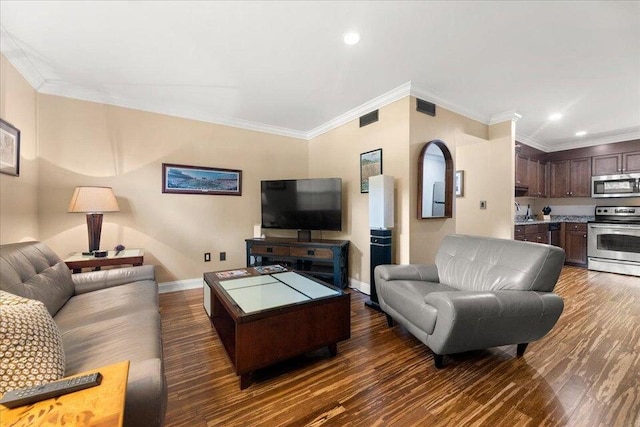 living area with dark wood-type flooring, visible vents, crown molding, and baseboards