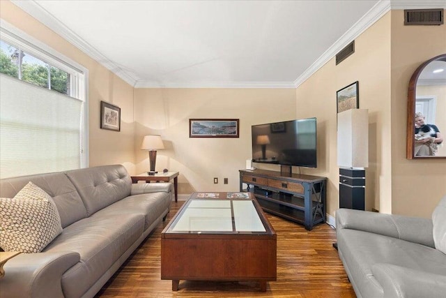 living room featuring ornamental molding, dark wood-style flooring, and visible vents