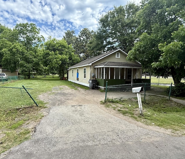 1902 Clifton St, North Charleston, SC 29406 - view of front of home featuring dirt driveway and view of wooded area