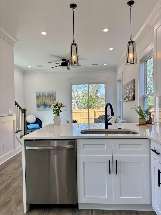 kitchen with dishwasher, decorative light fixtures, a healthy amount of sunlight, and a sink