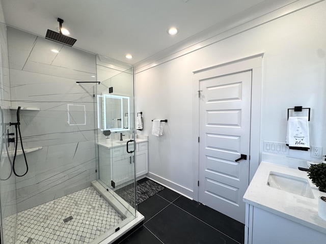 full bath with vanity, baseboards, recessed lighting, tile patterned flooring, and a shower stall