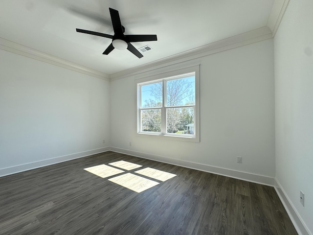 unfurnished room featuring visible vents, dark wood-style flooring, and crown molding