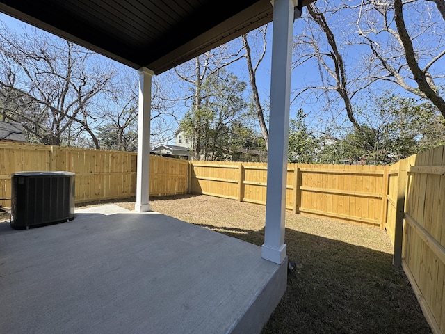 view of yard with cooling unit, a patio area, and a fenced backyard