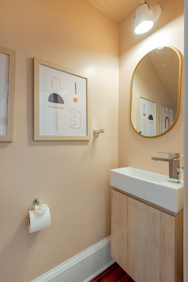 bathroom featuring hardwood / wood-style floors and vanity