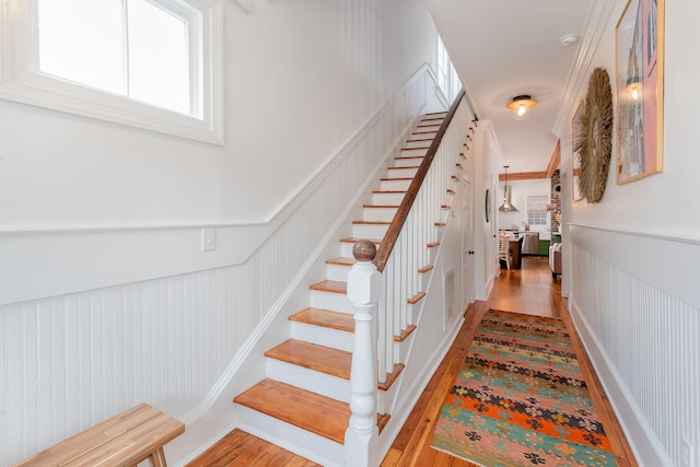 staircase featuring hardwood / wood-style floors