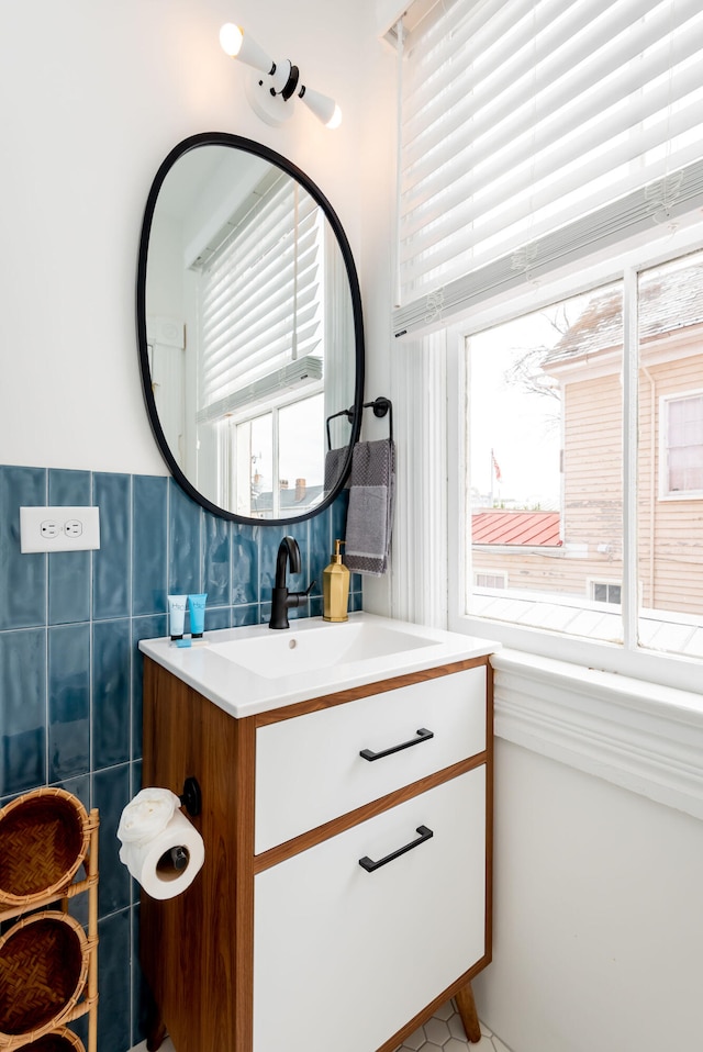 bathroom with vanity and a healthy amount of sunlight