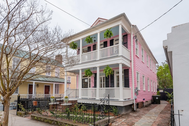 view of front of home featuring covered porch and a balcony