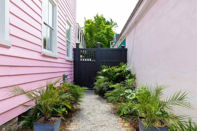 view of side of home with central air condition unit