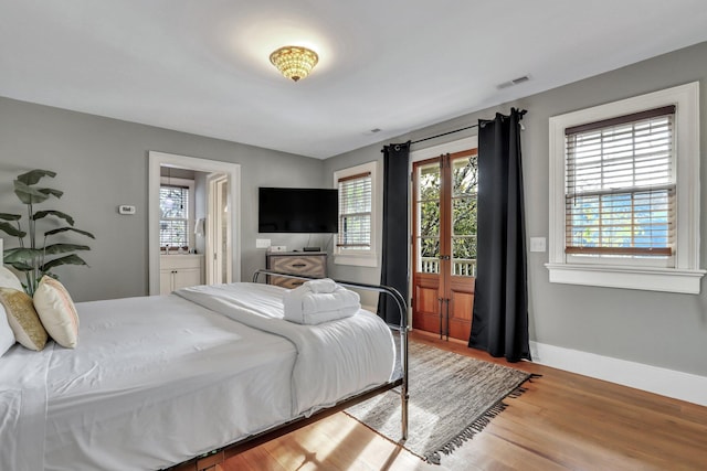 bedroom with hardwood / wood-style floors