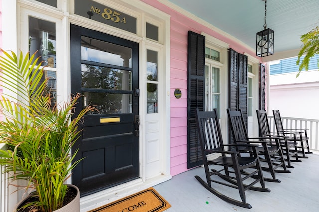 view of exterior entry featuring a porch