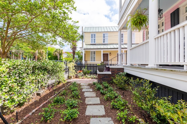 view of yard featuring covered porch