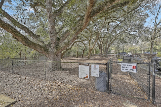 exterior space featuring a gate and fence