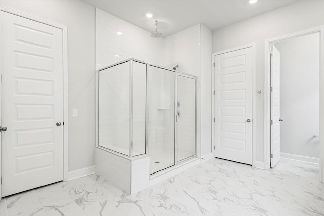 full bath with marble finish floors, a stall shower, recessed lighting, and baseboards