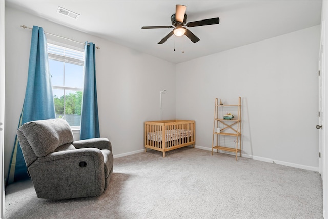 living area featuring a ceiling fan, carpet flooring, and baseboards
